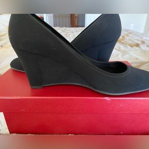 Salvatore Ferragamo black wedge heels.